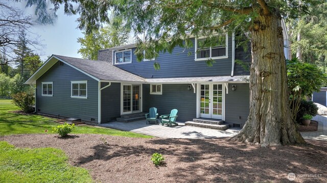 back of property featuring a patio, entry steps, french doors, and roof with shingles