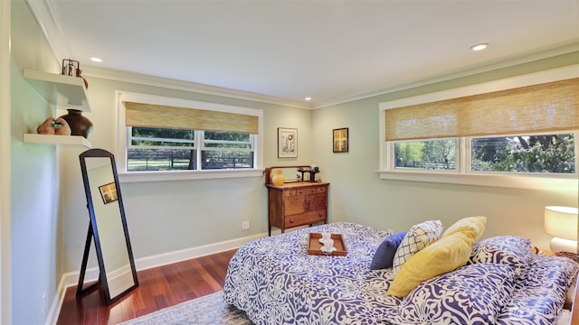 bedroom featuring wood finished floors, crown molding, recessed lighting, and baseboards