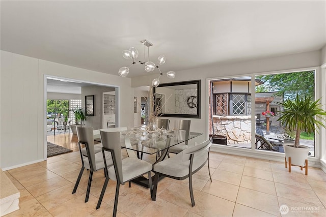 1423 Springwater Ave, Wenatchee, WA 98801 - dining space with light tile patterned floors, a chandelier, and baseboards