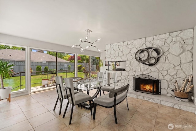 1423 Springwater Ave, Wenatchee, WA 98801 - dining space featuring a chandelier, a fireplace, and tile patterned flooring