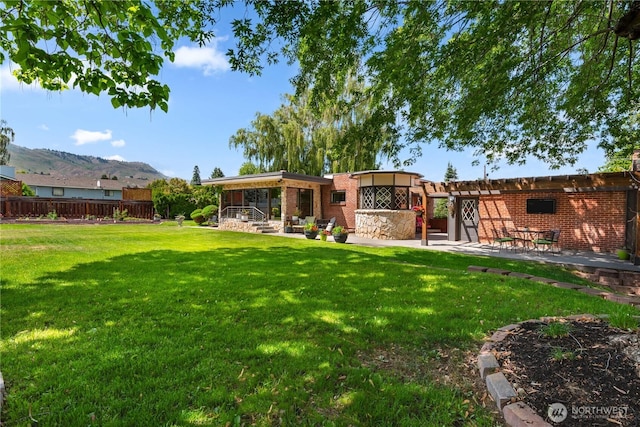 1423 Springwater Ave, Wenatchee, WA 98801 - view of yard with a patio and a mountain view