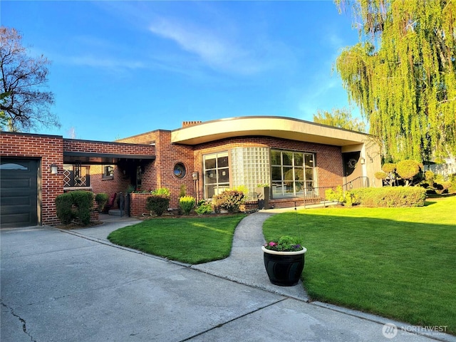 1423 Springwater Ave, Wenatchee, WA 98801 - view of front of property featuring brick siding, a front lawn, driveway, and an attached garage