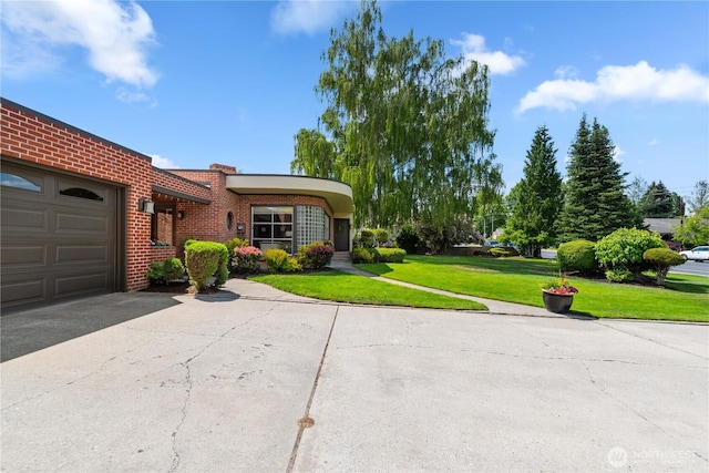 1423 Springwater Ave, Wenatchee, WA 98801 - view of front of home featuring an attached garage, driveway, a front yard, and brick siding