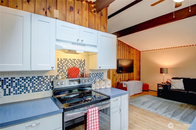 kitchen with decorative backsplash, stainless steel range with electric stovetop, lofted ceiling with beams, open floor plan, and under cabinet range hood