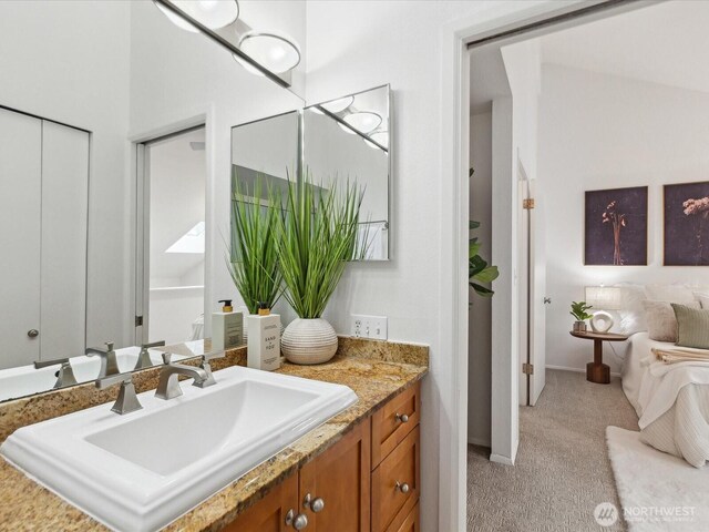 bathroom with vanity and baseboards