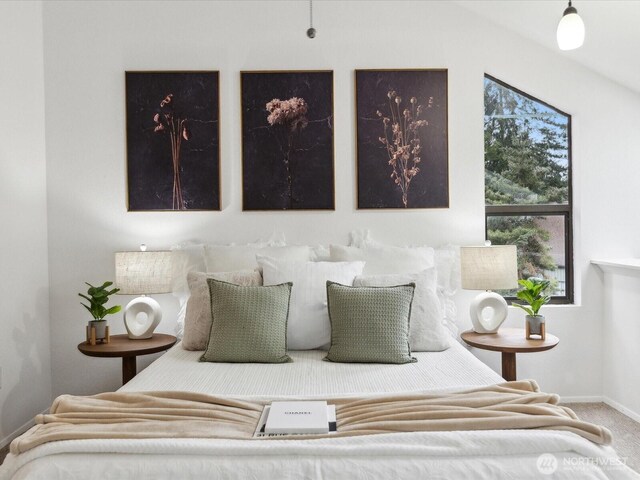 carpeted bedroom with baseboards