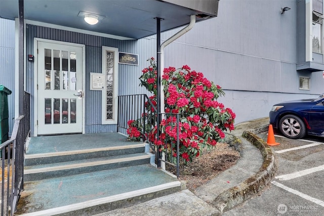 view of exterior entry with a porch