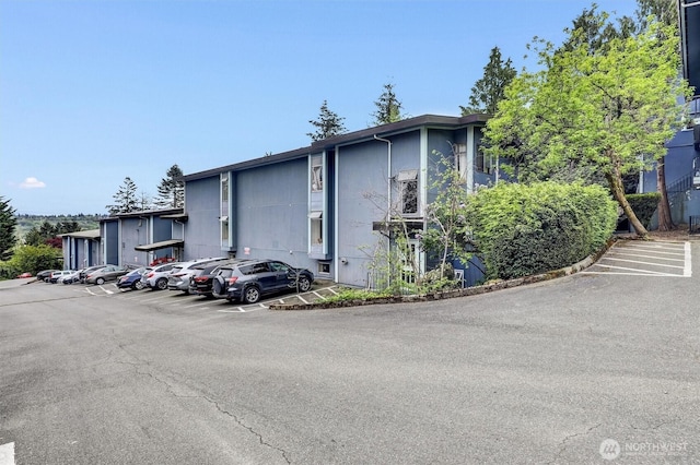 view of property with uncovered parking