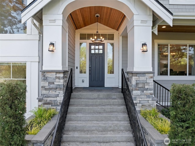 doorway to property with stone siding