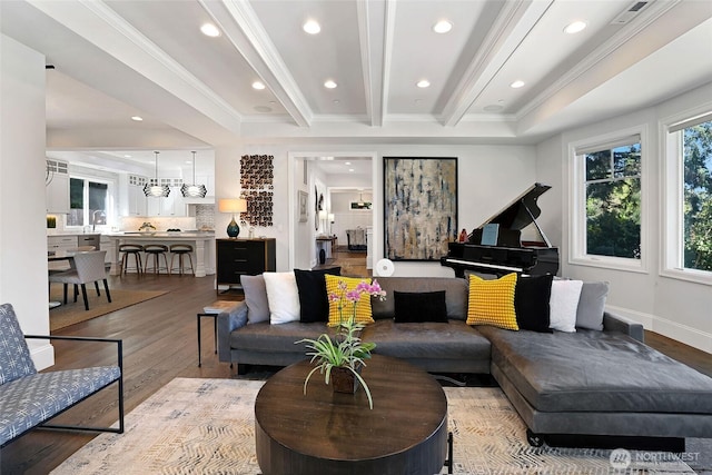 living room with crown molding, recessed lighting, and light wood-type flooring