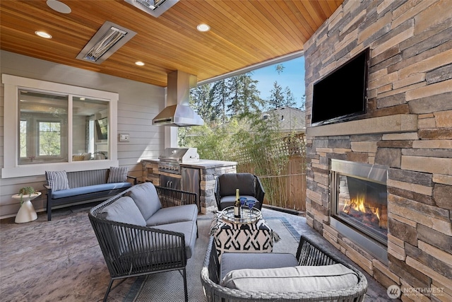 view of patio featuring area for grilling, grilling area, and an outdoor living space with a fireplace