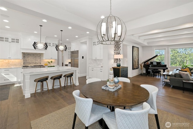 dining room featuring an inviting chandelier, recessed lighting, baseboards, and dark wood-style flooring