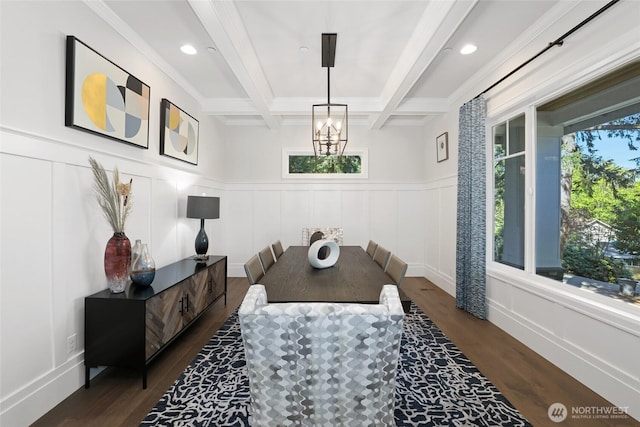 dining area with an inviting chandelier, dark wood-style flooring, a decorative wall, and beamed ceiling