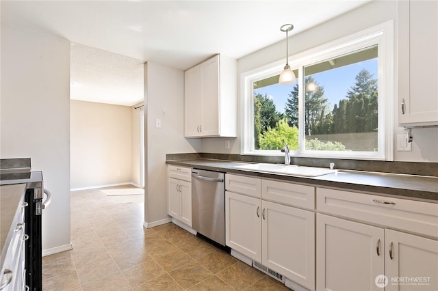 kitchen featuring a sink, dishwasher, dark countertops, white cabinetry, and hanging light fixtures