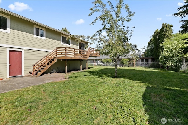 view of yard featuring stairs and a deck