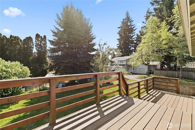 wooden terrace featuring fence