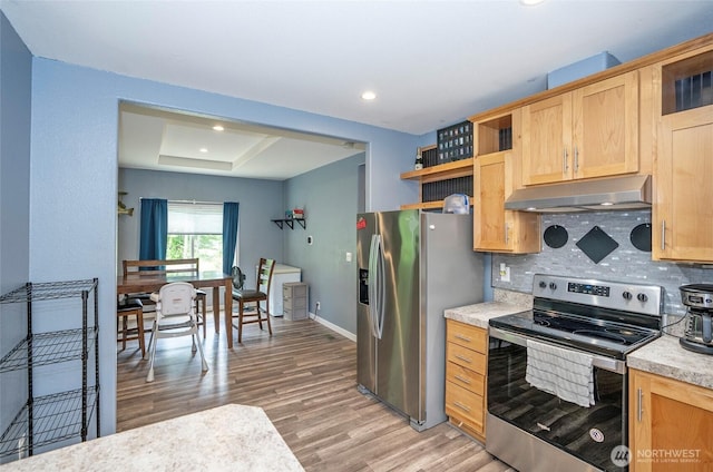 1332 SE Fireweed Rd, Shelton, WA 98584 - kitchen with under cabinet range hood, stainless steel appliances, open shelves, light wood finished floors, and light countertops