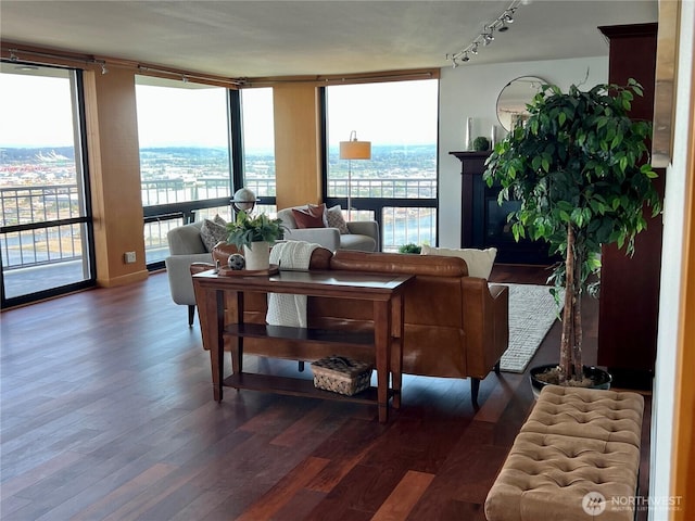 1 N Stadium Way Unit 16, Tacoma, WA 98403 - living room featuring wood finished floors, floor to ceiling windows, plenty of natural light, and rail lighting