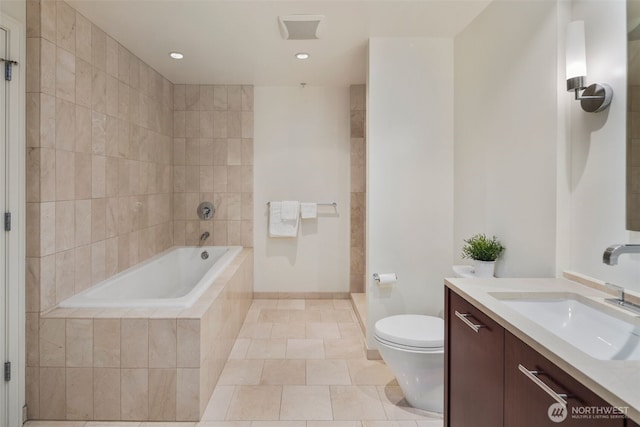 full bathroom with tiled bath, vanity, toilet, tile patterned flooring, and recessed lighting