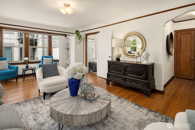 124 Warren Ave N Unit 302, Seattle, WA 98109 - living room with healthy amount of natural light, wood finished floors, baseboards, and crown molding