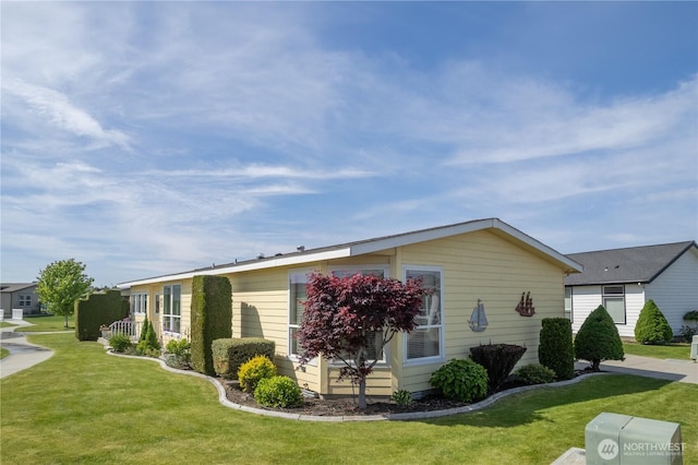 1701 E Burr Ave Unit 12, Moses Lake, WA 98837 - view of side of property featuring a yard