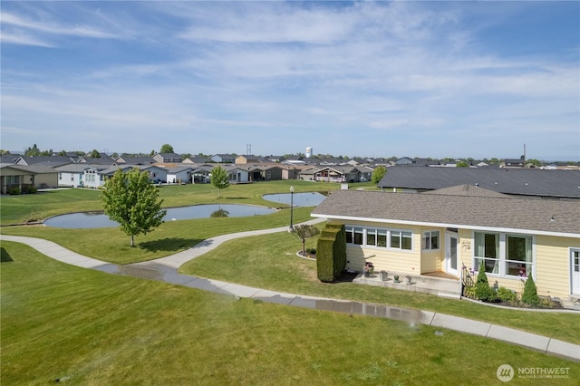 1701 E Burr Ave Unit 12, Moses Lake, WA 98837 - exterior space featuring a residential view, a yard, and a water view
