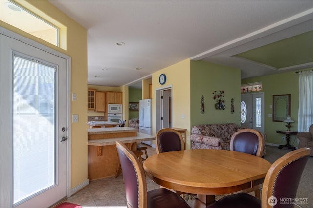 1701 E Burr Ave Unit 12, Moses Lake, WA 98837 - dining area featuring healthy amount of natural light and light tile patterned flooring