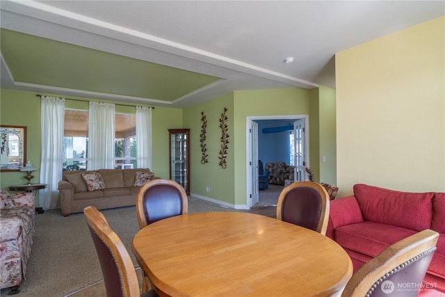1701 E Burr Ave Unit 12, Moses Lake, WA 98837 - dining space featuring carpet flooring, baseboards, and a tray ceiling