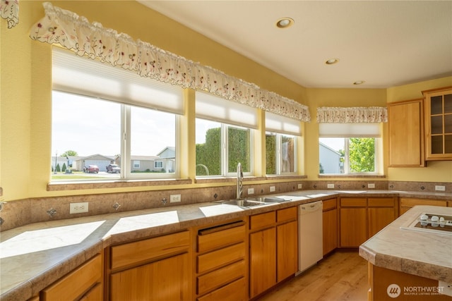 1701 E Burr Ave Unit 12, Moses Lake, WA 98837 - kitchen featuring a sink, white appliances, light wood-style floors, glass insert cabinets, and recessed lighting