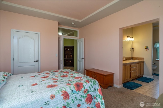 1701 E Burr Ave Unit 12, Moses Lake, WA 98837 - bedroom featuring ensuite bathroom, a sink, and baseboards