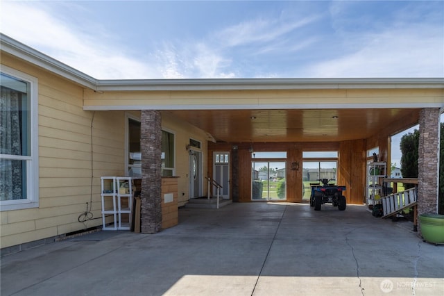 1701 E Burr Ave Unit 12, Moses Lake, WA 98837 - view of patio featuring concrete driveway and a carport