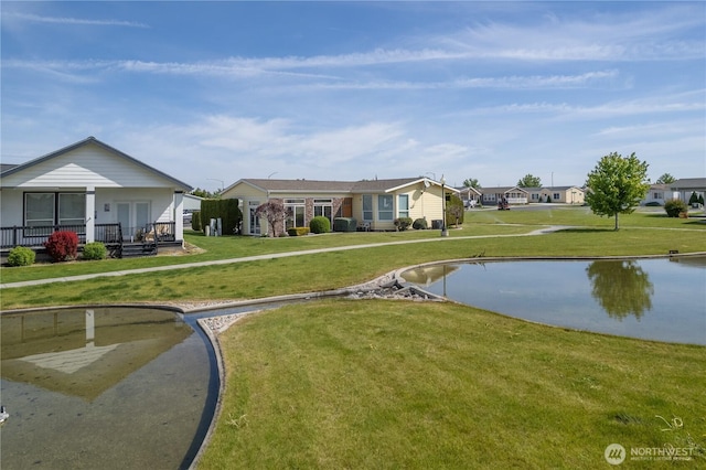 1701 E Burr Ave Unit 12, Moses Lake, WA 98837 - view of home's community featuring a yard, a water view, and a residential view
