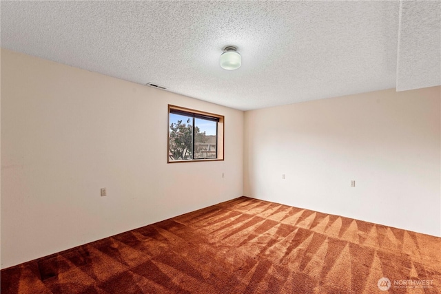 920 11th St NE, East Wenatchee, WA 98802 - spare room featuring carpet flooring and a textured ceiling