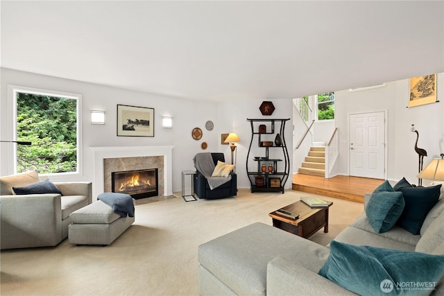 11210 67th Avenue Ct NW, Gig Harbor, WA 98332 - living area with light carpet, a fireplace, and stairway