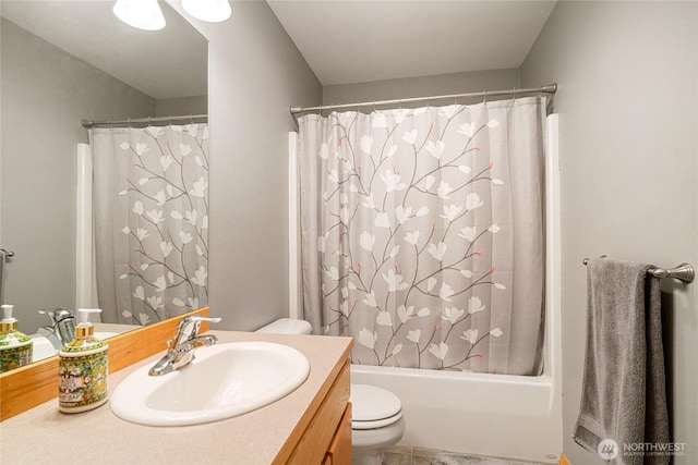 bathroom with shower / tub combo, toilet, and vanity