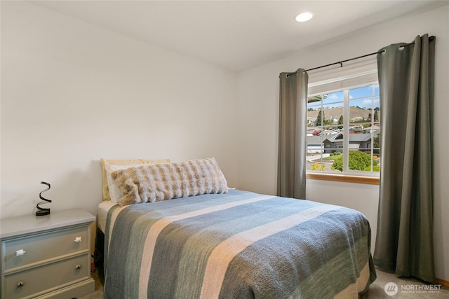 carpeted bedroom with recessed lighting