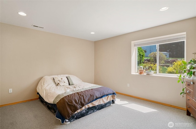 carpeted bedroom featuring baseboards, visible vents, and recessed lighting