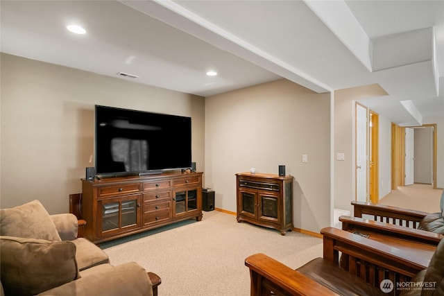 living area with baseboards, visible vents, recessed lighting, and light colored carpet