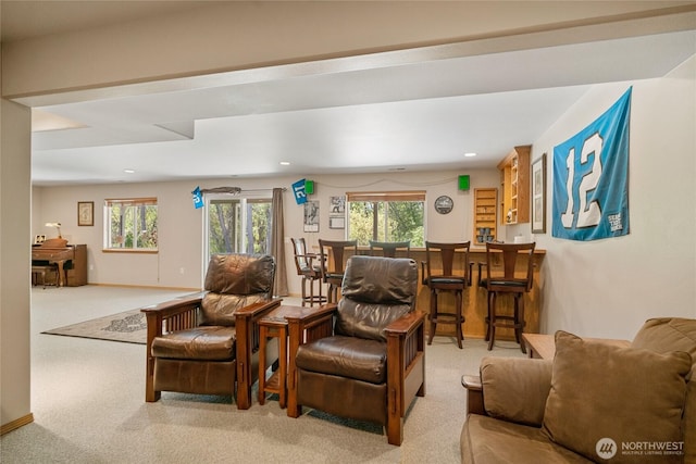 living area featuring recessed lighting, a dry bar, and carpet