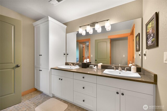3445 S Bay Dr, Sedro Woolley, WA 98284 - bathroom with double vanity, visible vents, and a sink