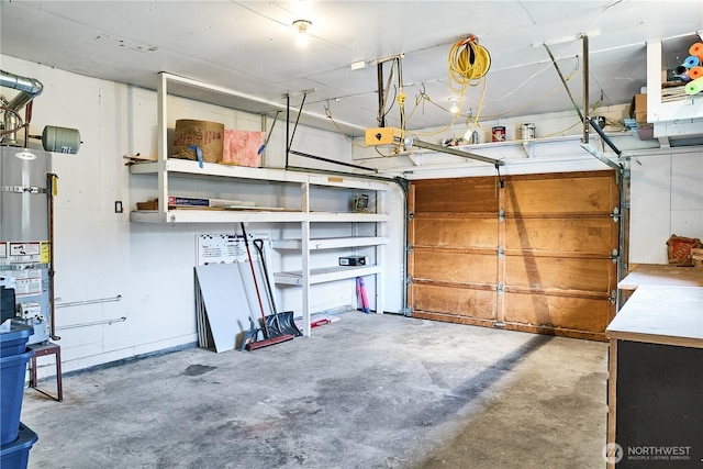 garage featuring water heater and a garage door opener