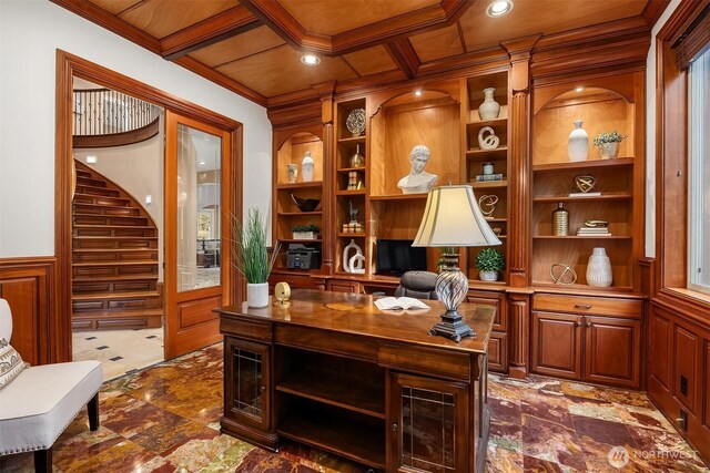 office with wainscoting, built in features, coffered ceiling, and ornamental molding