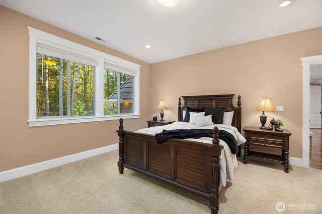 bedroom featuring recessed lighting, baseboards, and light carpet