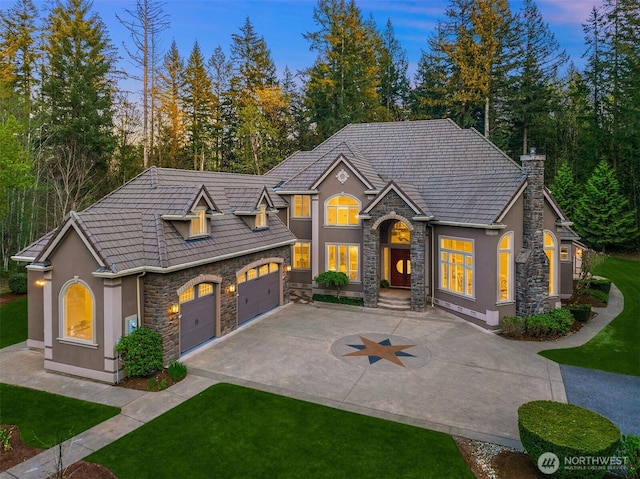 16243 SE 326th St, Auburn, WA 98092 - view of front of house with stone siding, stucco siding, concrete driveway, and a front lawn