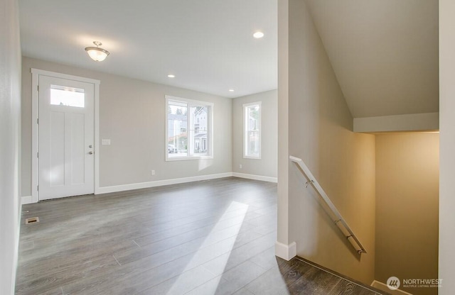 entryway with recessed lighting, wood finished floors, and baseboards