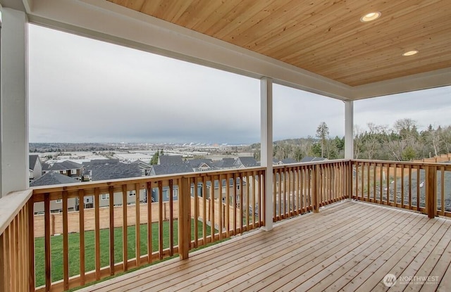 wooden deck with a yard