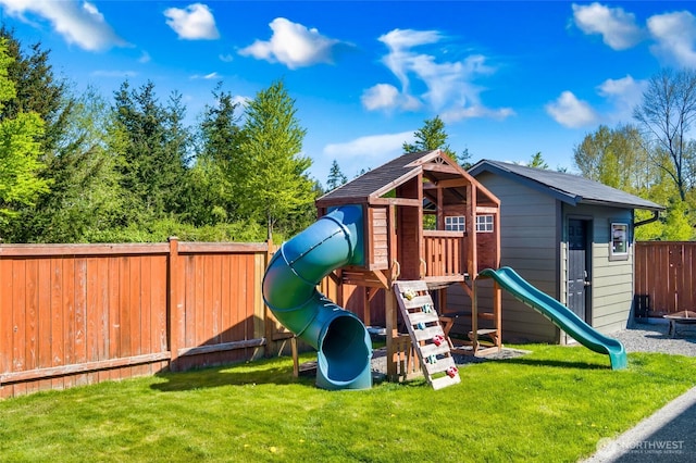 view of play area featuring fence and a yard