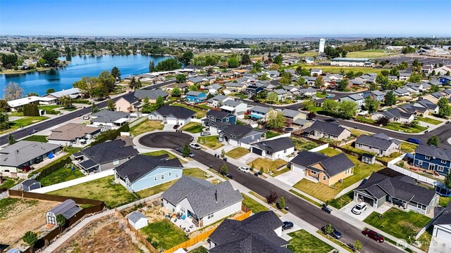 aerial view with a water view and a residential view