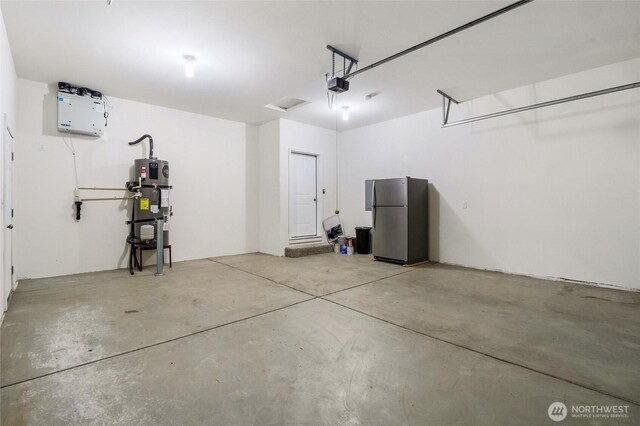 garage with a garage door opener, freestanding refrigerator, and heat pump water heater