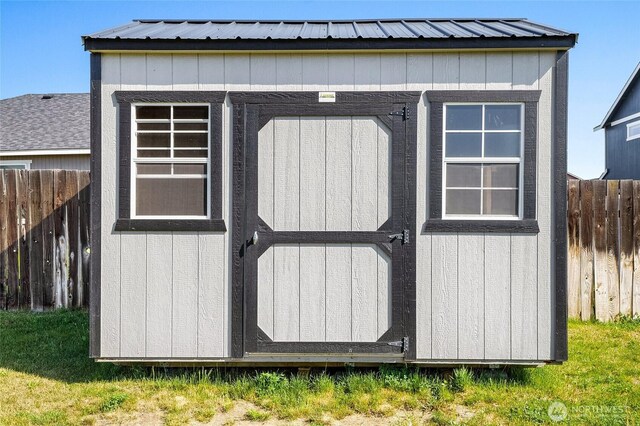 view of shed featuring a fenced backyard